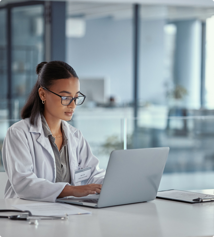 Female doctor using laptop